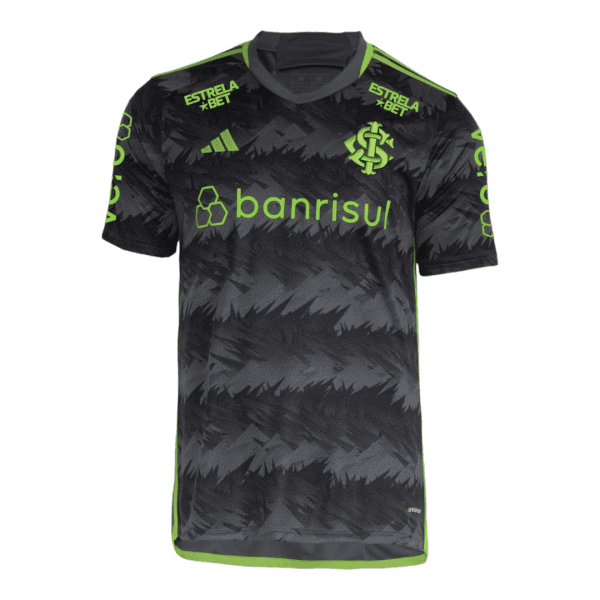 Black and gray camouflage-style soccer jersey with neon green piping and sponsor logos (Banrisul, Estrela Bet) across the chest and shoulders.