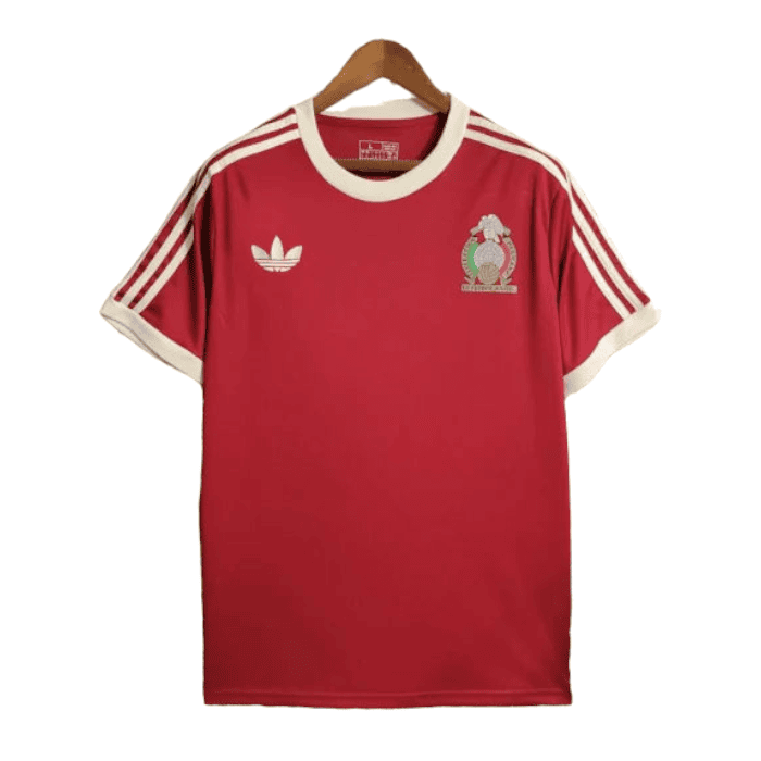 PhotoRoom-20240112-234321 | AE JERSEY Red Adidas football jersey on a hanger with white collar and sleeves, three white stripes on the shoulders, crest on left chest, and Adidas logo on right chest.