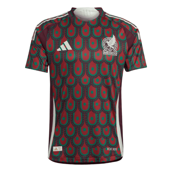 Front view of a Mexico national soccer jersey with a red and green patterned design, white Adidas logo, and the team crest reading 'MEXICO'.