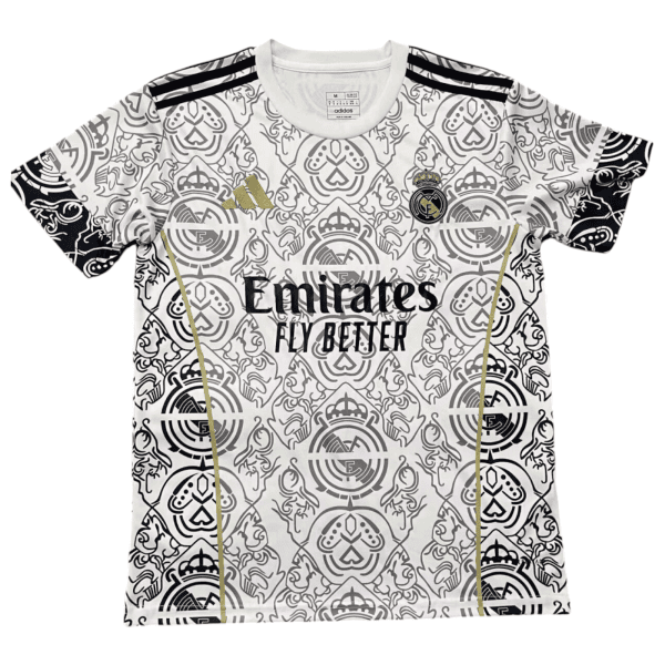 White Real Madrid soccer jersey with an ornate monochrome crest pattern, featuring the Real Madrid crest, Adidas logo, and Emirates Fly Better sponsor text.
