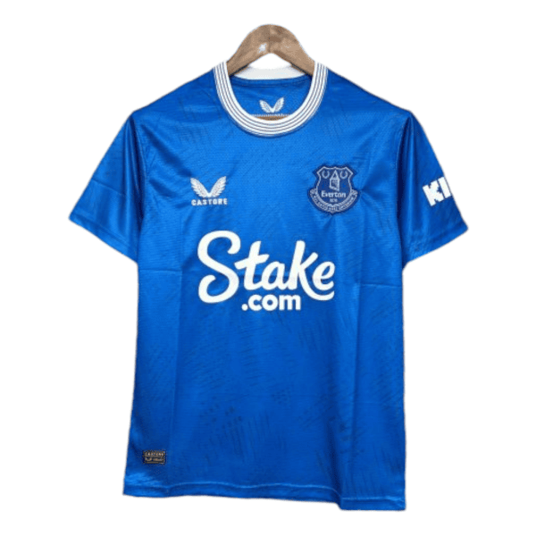 Blue Everton football jersey on hanger with sponsor 'Stake.com' and club crest, front view (informative)