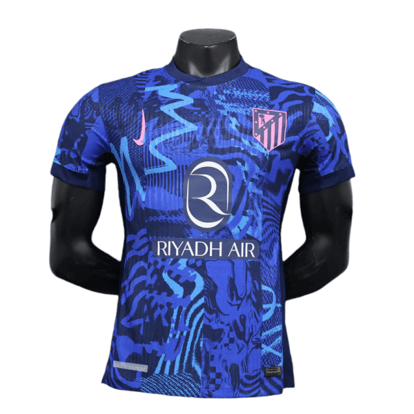 Blue Atlético Madrid football jersey with Riyadh Air sponsor on a mannequin.