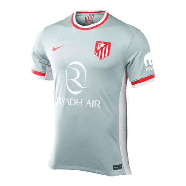 Light blue soccer jersey with red trim and white side panels, featuring the Atlético Madrid crest and Riyadh Air sponsor logo on the front.