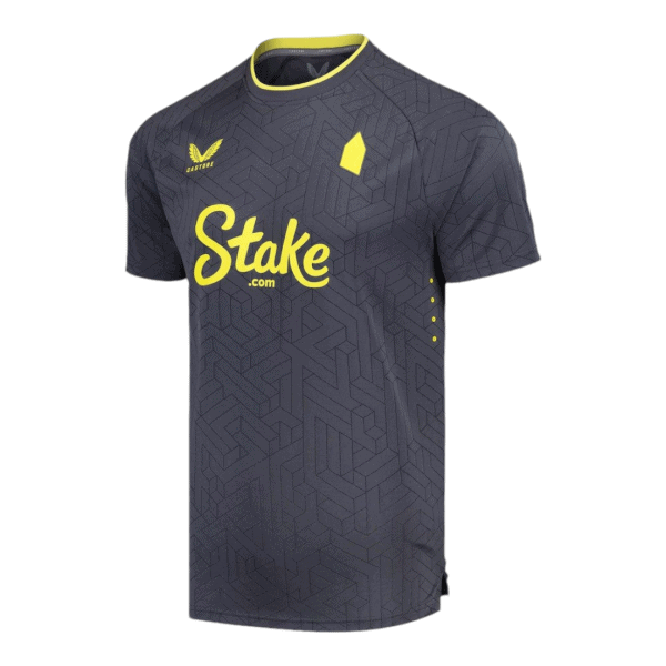 Dark gray athletic jersey with a neon yellow collar trim, geometric pattern, and a large yellow 'Stake.com' logo across the chest.