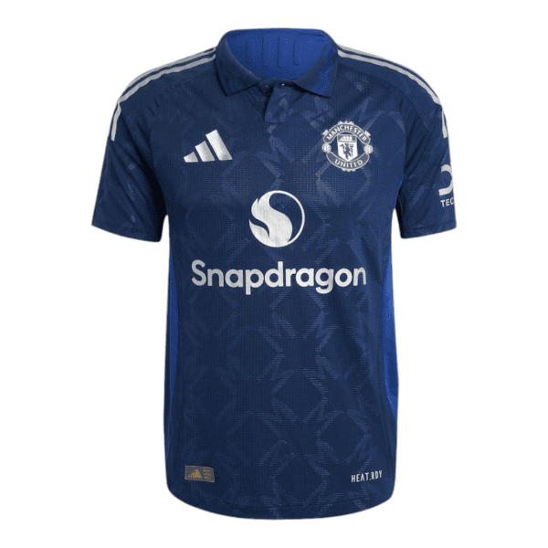 Manchester United dark blue away jersey featuring the Snapdragon sponsor and club crest.