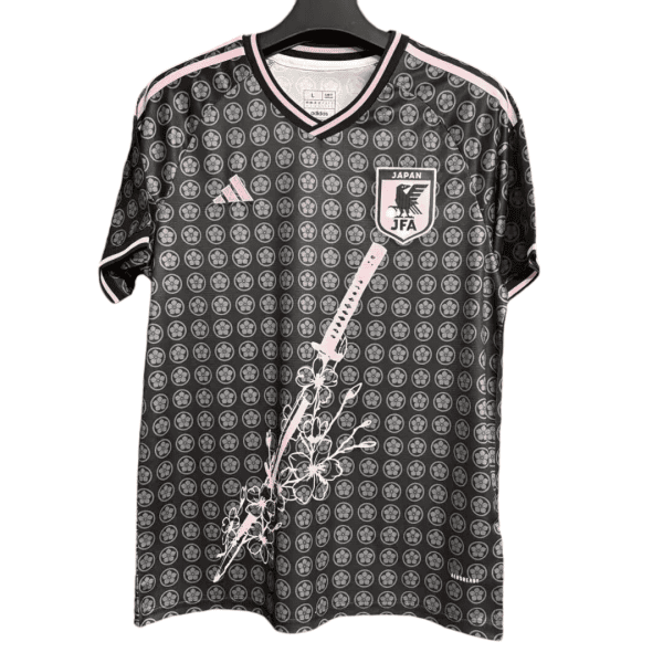 Japan national football team jersey with pink trim and floral sword graphic on the front