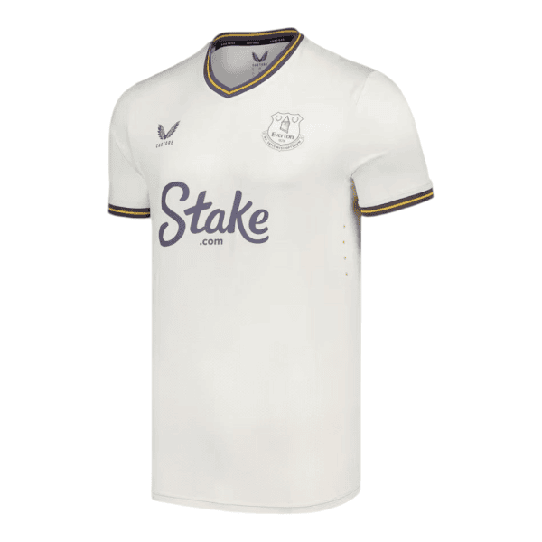 Cream Everton football jersey with purple-yellow trim and Stake sponsorship across the chest (soccer kit)