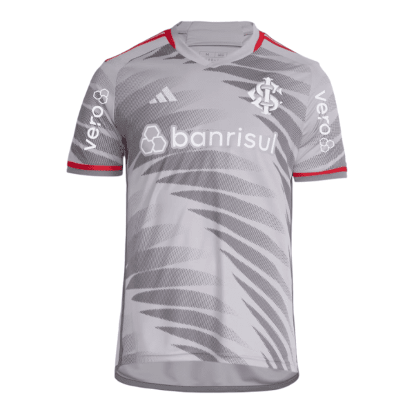 Front view of a gray soccer jersey with an abstract diagonal pattern, white 'banrisul' sponsor across the chest, club crest on the left chest, and Adidas logo; red trim on sleeves.