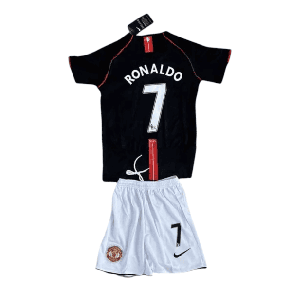 Black Ronaldo jersey with white 'RONALDO' and large number 7, red piping, worn with white Manchester United shorts.