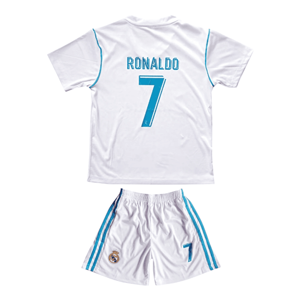 Back view of a white Real Madrid soccer jersey with blue trim and a large turquoise number 7 on the back.