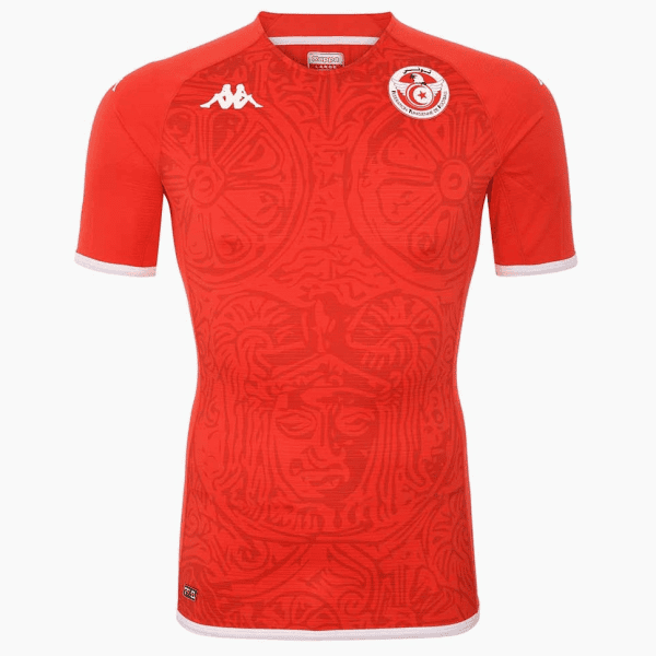 Red soccer jersey with white-trim sleeves and a circular team crest on the left chest, featuring a stylized emblem.