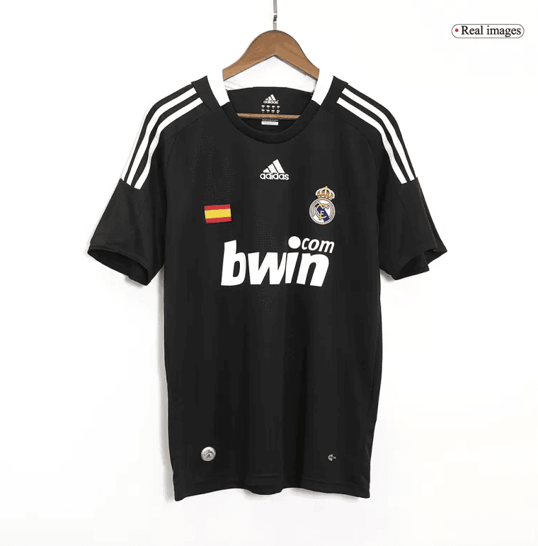 Screenshot_2024-06-27_021448 | AE JERSEY Black Real Madrid football jersey on a hanger with crest, Spanish flag patch, and bwin sponsor on the front.