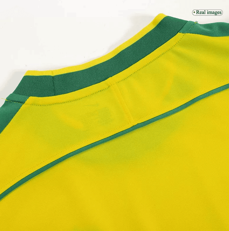 Screenshot_2024-07-20_032627 | AE JERSEY Close-up of a yellow jersey with a green collar and seam details along the shoulder area.