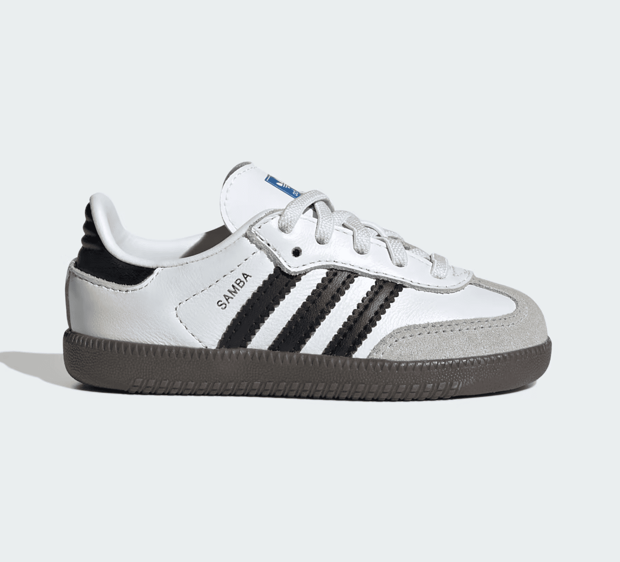 Screenshot_2025-02-10_200949 | AE JERSEY White Adidas Samba-style sneaker with black stripes, white upper, beige suede toe cap, and brown sole, side view