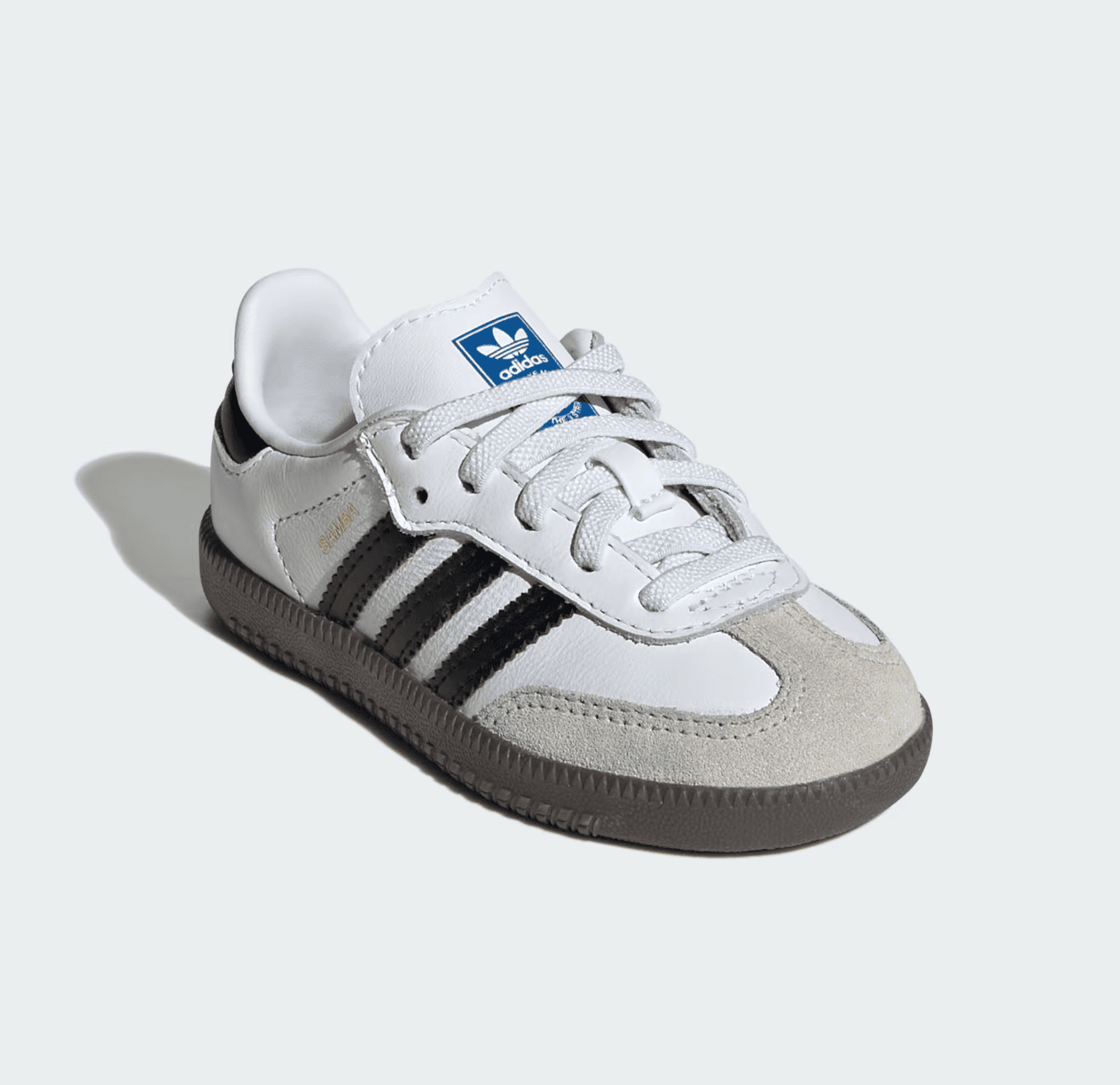 Screenshot_2025-02-10_201017 | AE JERSEY White Adidas Samba sneaker with black stripes and gray sole on a pale background, toe suede cap visible.