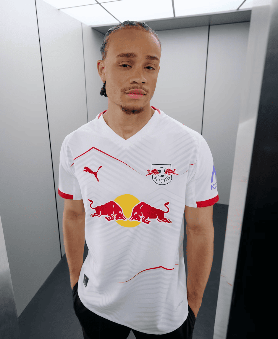 Screenshot_2025-06-19_045220 | AE JERSEY Portrait of a young man in a white RB Leipzig football jersey posing in an elevator or narrow hallway.