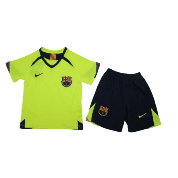 Neon yellow FC Barcelona soccer jersey with crest and Nike swoosh, paired with navy shorts featuring neon accents.