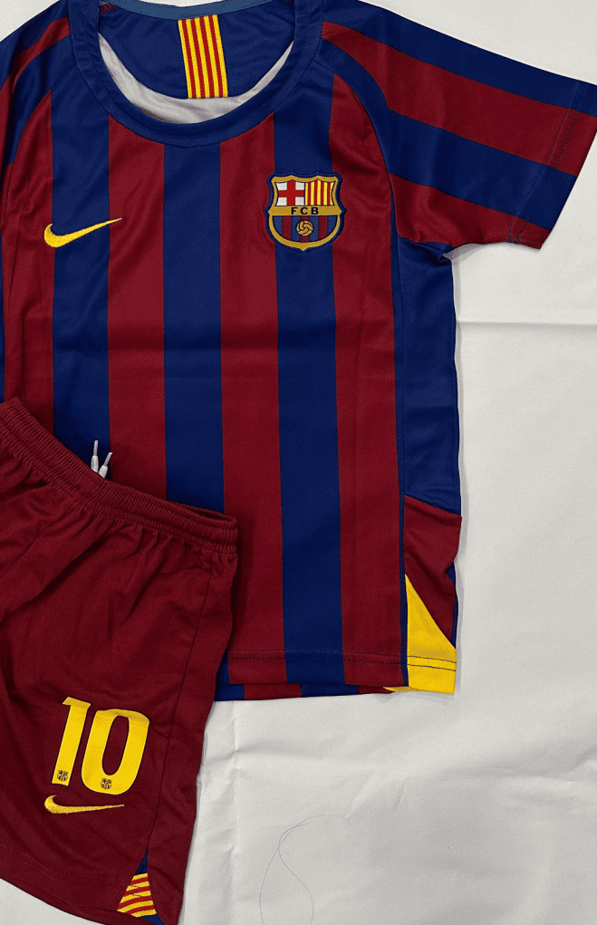 Screenshot_2025-07-21_185705 | AE JERSEY FC Barcelona football kit: blue and maroon striped jersey with club crest and yellow Nike swoosh, paired with maroon shorts bearing the number 10.