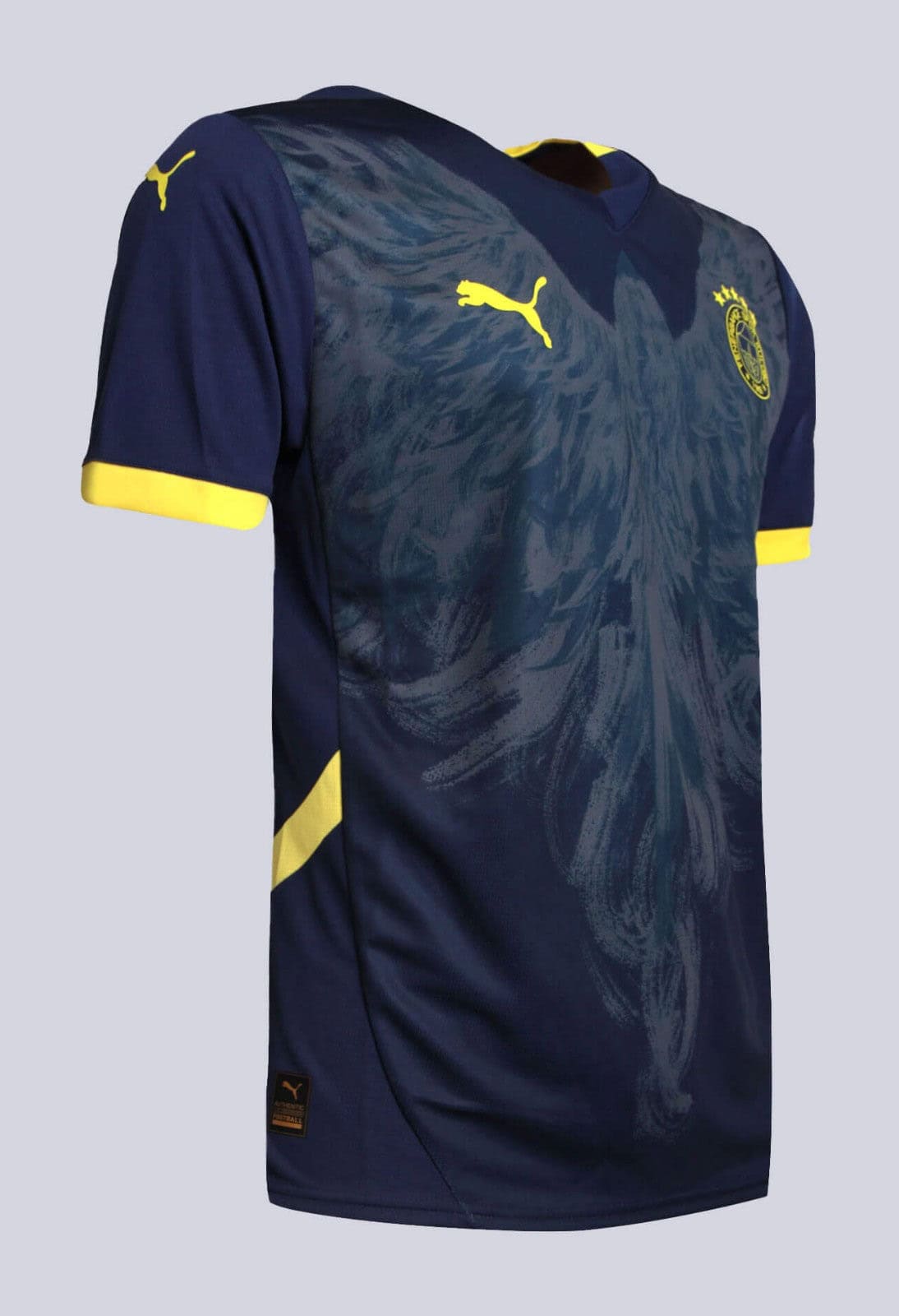 UiOzWiRtwk5wsxf | AE JERSEY Navy blue soccer jersey with yellow Puma logos and crest, featuring yellow sleeve cuffs and a subtle pattern across the front.