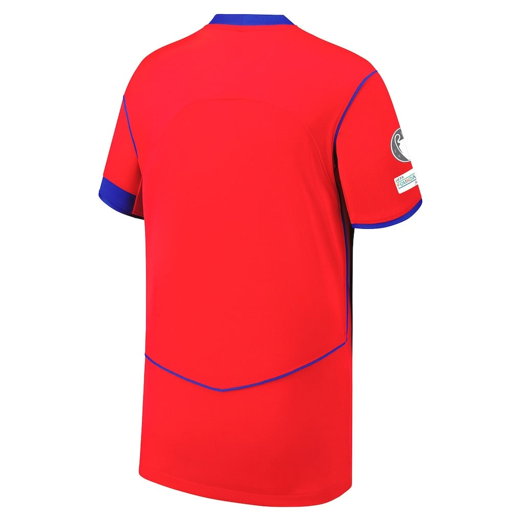 V6-1 | AE JERSEY Back view of a bright red sports jersey with blue trim along the sleeves and hem, showing a simple design and a patch on the right sleeve