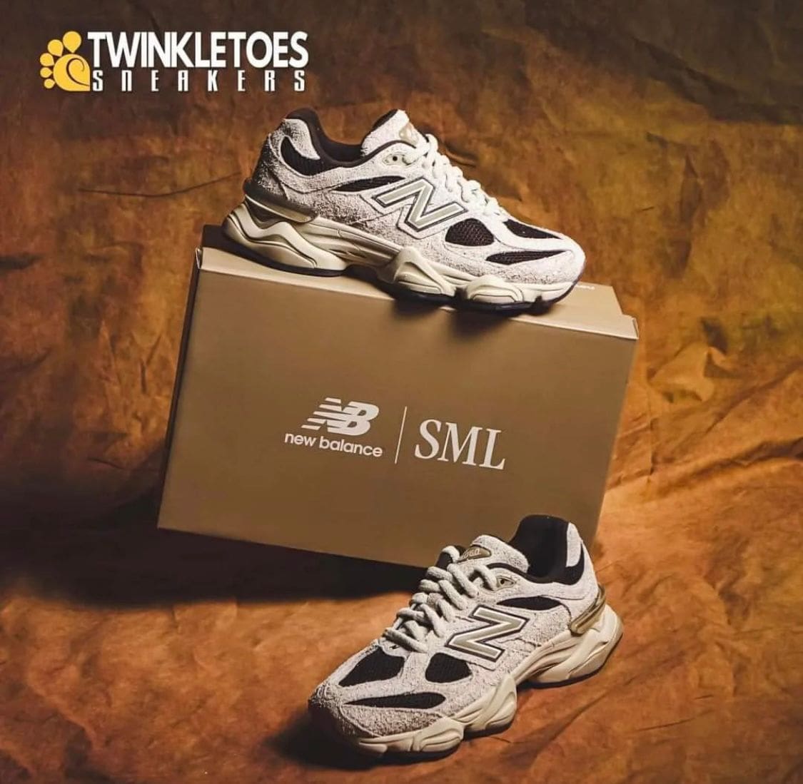 WhatsApp_Image_2024-07-27_at_01.11.32 | AE JERSEY Two white and black New Balance sneakers displayed on and beside a brown shoe box with SML branding; Twinkletoes Sneakers logo in the top-left corner.