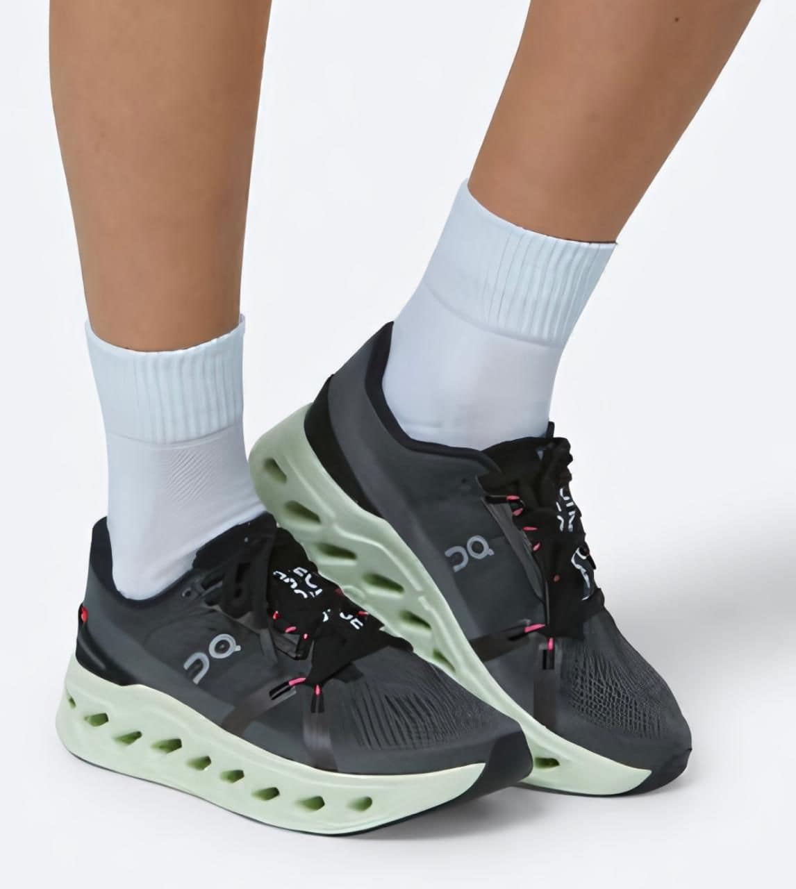 WhatsApp_Image_2025-01-19_at_11.58.42 | AE JERSEY Gray and black running shoes with a lime-green cushioned sole, worn with white crew socks.