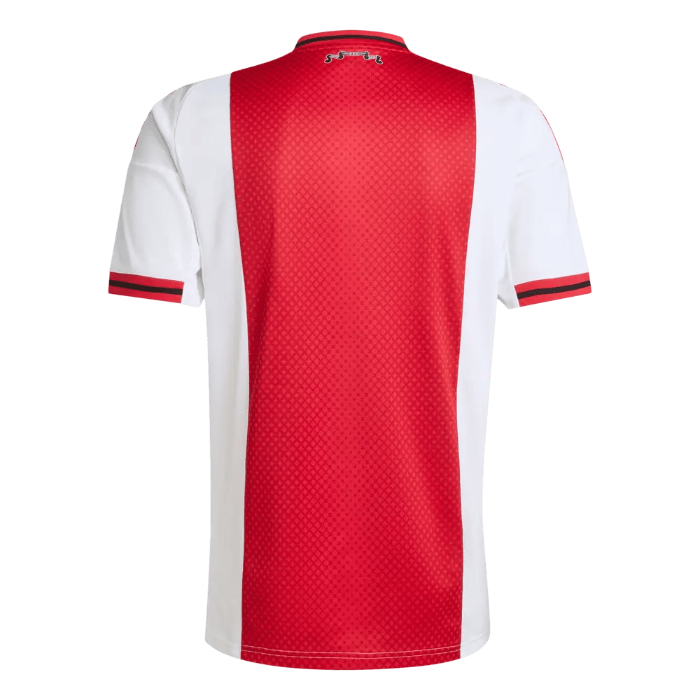 a02ed1cc-3e5d-d060-ac82-418632f36262 | AE JERSEY Back of a red and white soccer jersey with a central red honeycomb panel, white sides, and red/black cuff stripes on the sleeves.