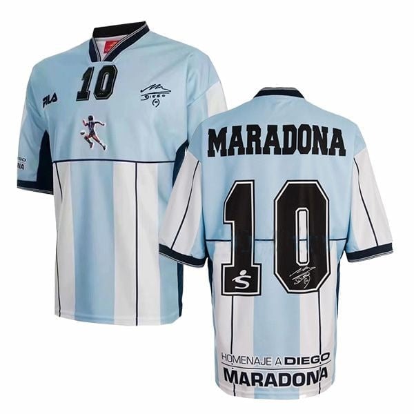 Light blue and white striped soccer jersey with number 10 and MARADONA on the back, front shows small crest and player graphic. Front view highlights: number 10 and team crest on the chest.
