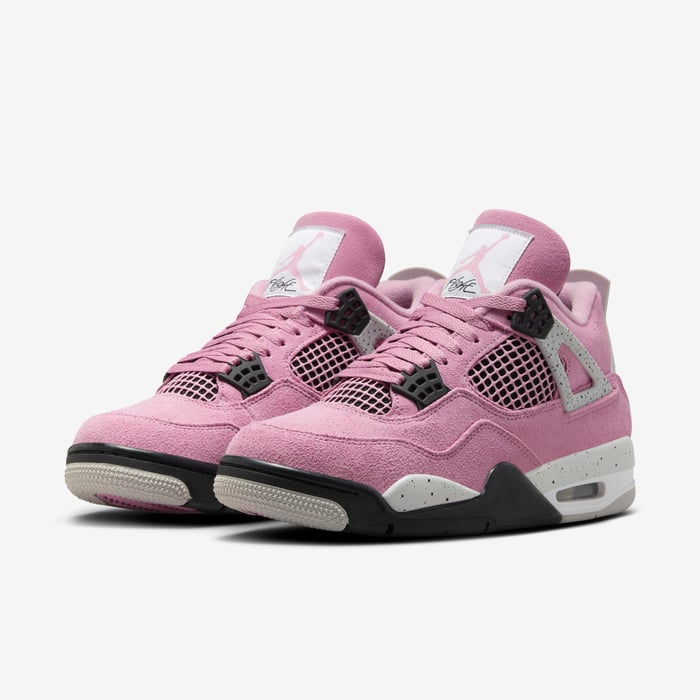 ac6552bc_19f7_4c04_8634_72f510c9ee49 | AE JERSEY Pair of pink suede sneakers with black plastic eyelets and mesh panels, white midsole, and light-gray outsole, shown side by side.