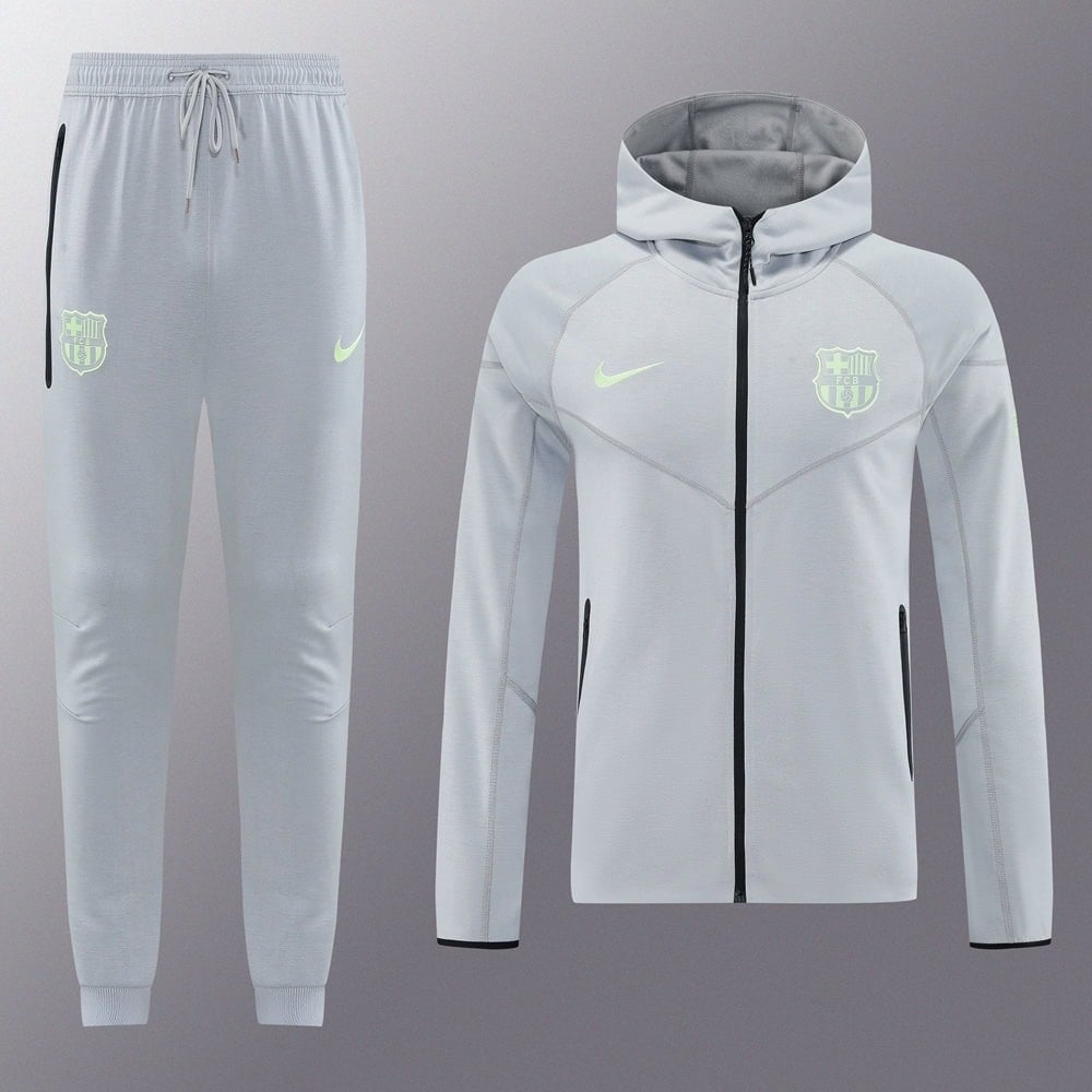 ad7940f7 | AE JERSEY Light gray Barcelona training tracksuit—zip-up jacket with neon Nike swoosh and club crest, paired with matching jogger pants with drawstring.