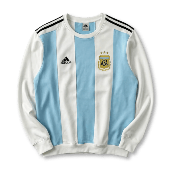 Argentina national football jersey with blue and white vertical stripes and crest on the chest (Adidas logo left)