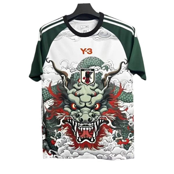 T-shirt with a fierce dragon graphic on a white front and green sleeves, orange Y-3 logo near the collar, three white stripes on the shoulders.