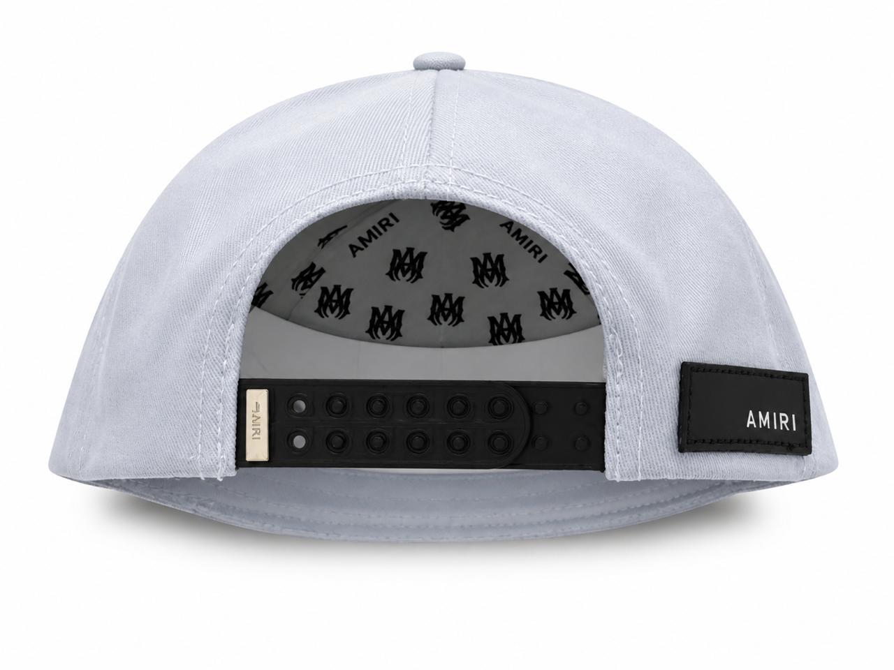 b9b6cd84-6ad7-4d99-b865-ba31e0c1f9bd | AE JERSEY Light-gray snapback cap viewed from the back, showing a black plastic strap and a small Amiri label on a patch at the side edge of the opening.