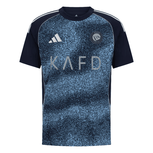 Blue and navy patterned athletic jersey with 'KAFD' across the chest, Adidas logo on the left and a circular club crest on the right chest.