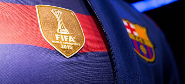barcelona-classic-201516-final-with-messi-10-badges-jersey-315184 | AE JERSEY Close-up of a blue-and-red FC Barcelona jersey with the FIFA World Champions 2015 patch visible