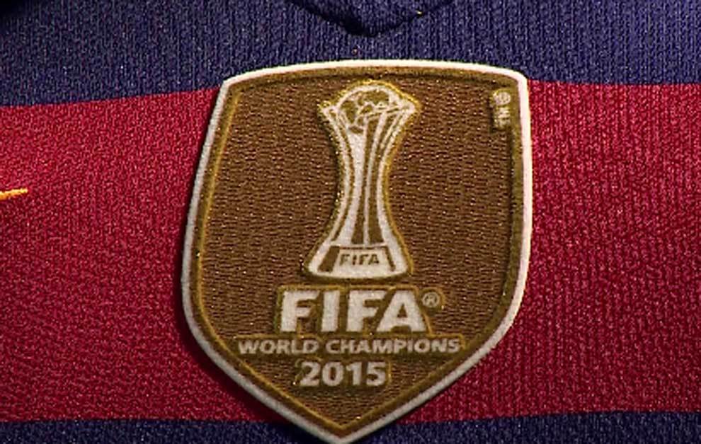 barcelona-classic-201516-final-with-messi-10-badges-jersey-409929 | AE JERSEY FIFA World Champions 2015 badge on a red and blue soccer jersey with a gold shield design.