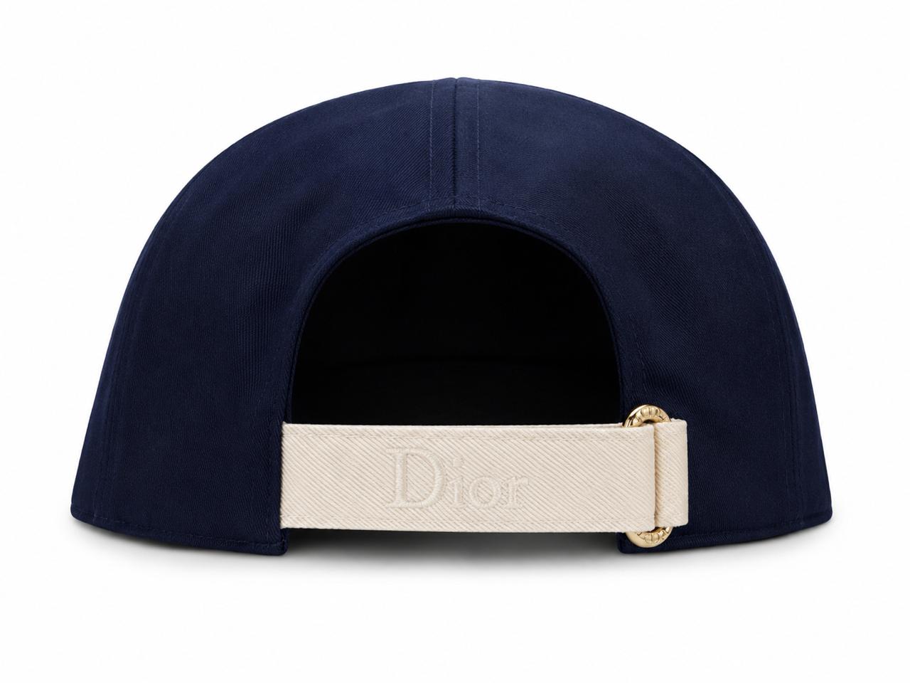 bf1b0665-fb73-4f35-858f-c72d767b4ce3 | AE JERSEY Navy curved-back cap viewed from the rear with a beige strap embossed with 'Dior' seen at the back.