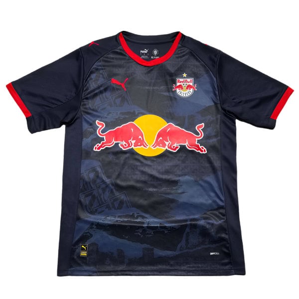 Dark blue Red Bull soccer jersey with a large Red Bull logo on the front over a yellow circle, team crest on the left chest, Puma logo on the right, and red trim on the collar and sleeves.