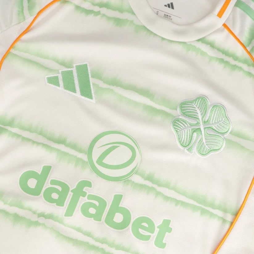 celtic-men-s-2025-26-third-shirt-1180888103 | AE JERSEY Close-up of a white jersey with mint-green tie-dye pattern, displaying the Dafabet sponsor text and Adidas logo.