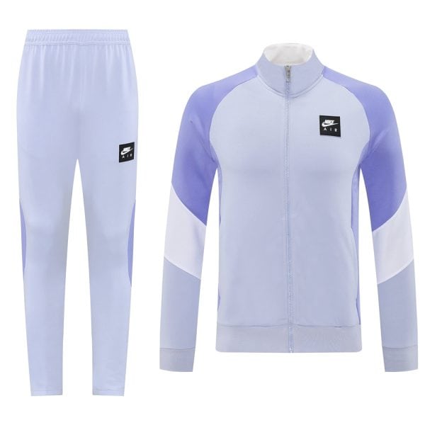 Light purple Nike Air tracksuit jacket with color-block panels and matching lavender pants, logo on chest/pants.