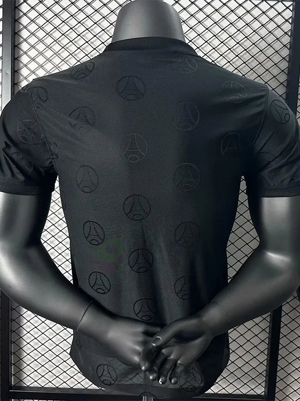 dede44fae42d4929 | AE JERSEY Back view of a black T-shirt on a mannequin with a subtle repeating logo pattern across the fabric.