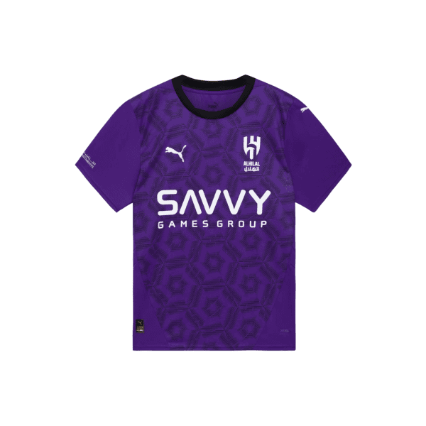 Purple football jersey with black collar and geometric hex pattern, featuring the white 'SAVVY GAMES GROUP' sponsor across the chest and the ALHILAL crest with Puma branding on the chest.