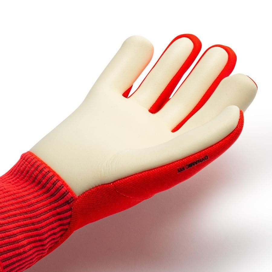 e5a3850cf03a4601589474f6ea63243e | AE JERSEY White rubber glove with a red fabric cuff on a white background.
