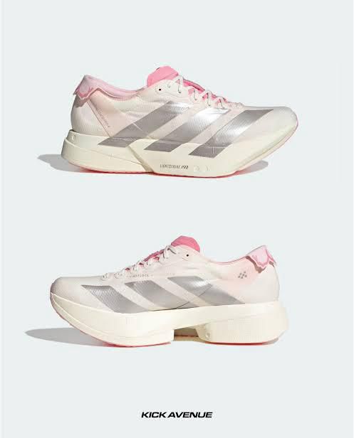 ea130b72-8c7f-43ae-9536-0392ba803a1d | AE JERSEY Two pink-and-white sneakers with a chunky sole shown from side and profile; Kick Avenue branding at the bottom of the image.