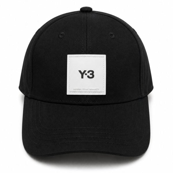 Black baseball cap with a white Y-3 logo patch on the front.