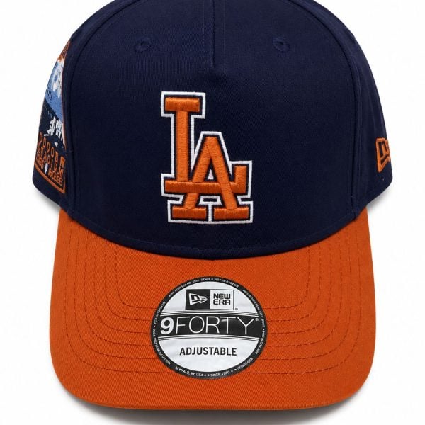 Navy baseball cap with an orange LA logo on the front and an orange curved brim, adjustable strap at back (New Era)