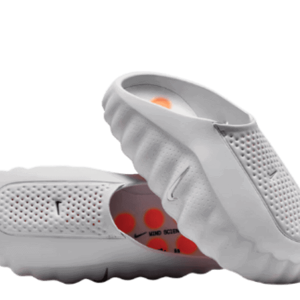 White perforated slip-on athletic shoe with a flexible ridged sole, designed for breathable comfort.