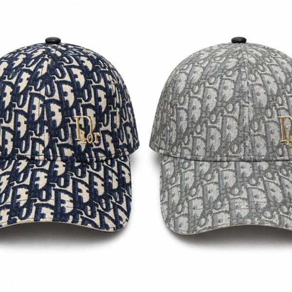 Two Dior monogram baseball caps in navy and gray, each with a gold Dior logo on the front.