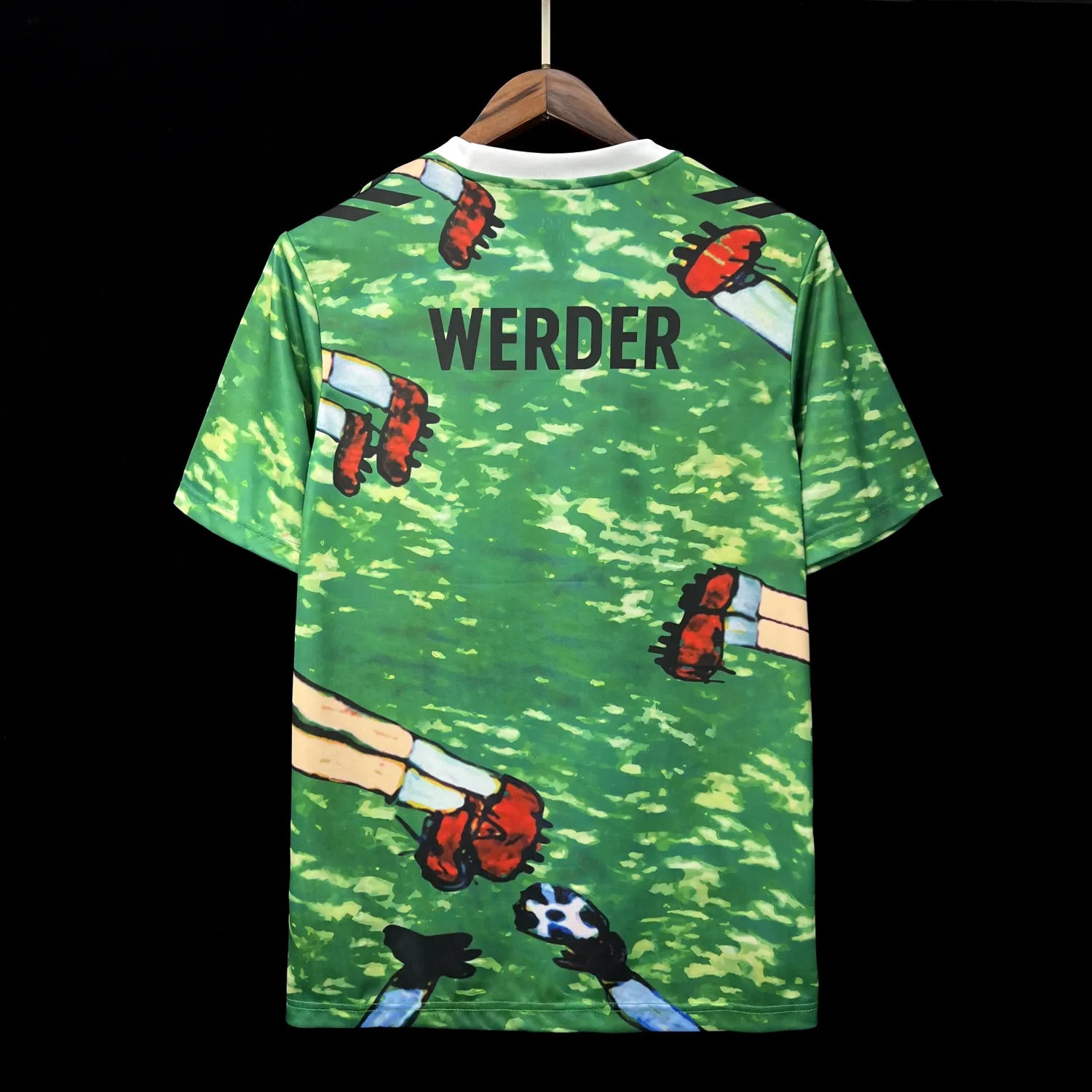 ff5c67effa076605 | AE JERSEY Green camouflage-pattern T-shirt on a hanger with cartoon limbs print and the word 'WERDER' on the back.