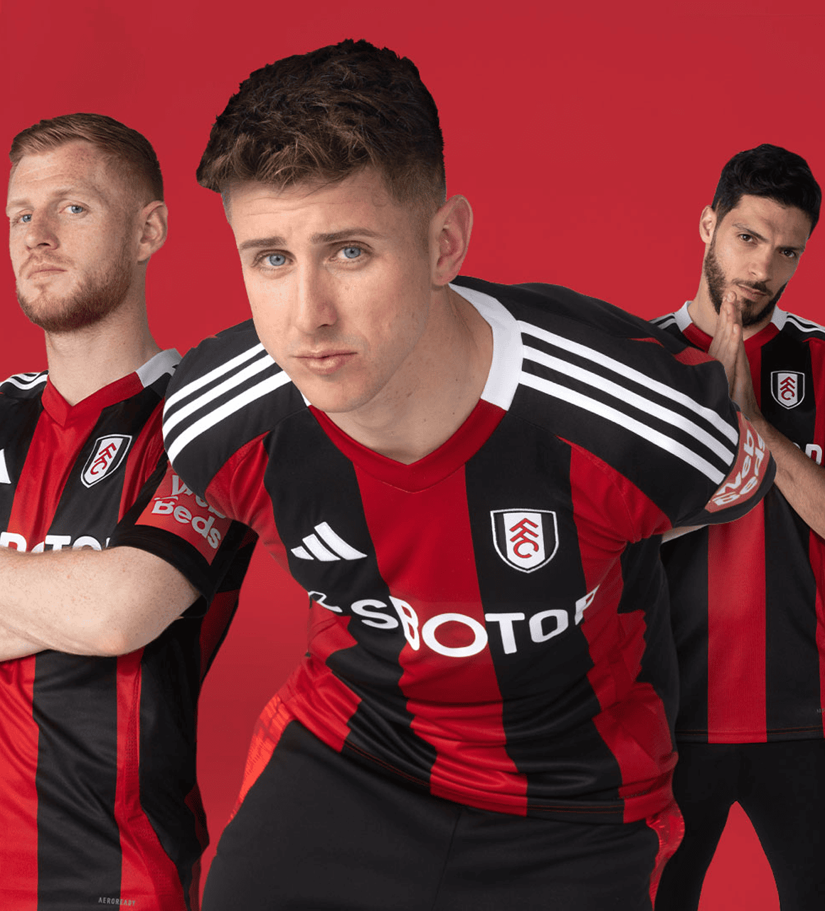 fulham2 | AE JERSEY Three male soccer players in red-and-black striped kits pose together against a red background, with the center player leaning forward toward the camera.